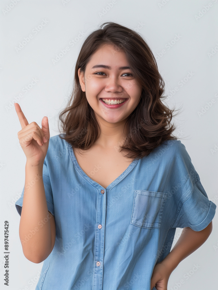 Indonesian adult women looking at camera. pointing to the left or right. asian women advertising photography. enthusiastic. excited. white background Indonesian adult women looking at camera. pointing to the left or right. asian women advertising photography. enthusiastic. excited. white background