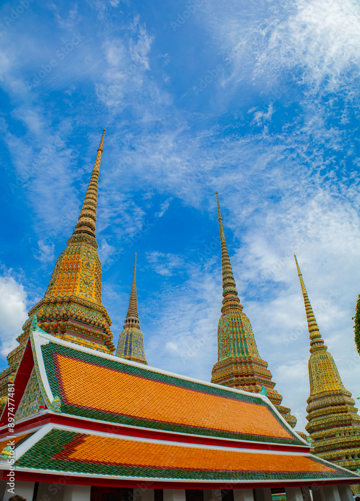 Fototapeta premium Picture of pagodas in Wat Pho in Bangkok, Thailand, one of Thailand's oldest temples.