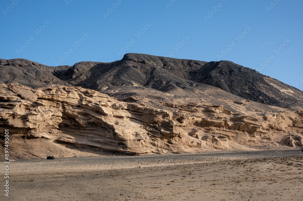 Ventifact rock formations caused by wind at La Pared Beach, Fuerteventura Ventifact rock formations caused by wind at La Pared Beach, Fuerteventura