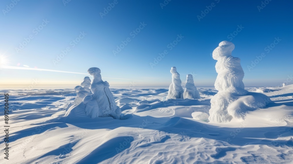 A snowy landscape with snowmen and snow sculptures A snowy landscape with snowmen and snow sculptures