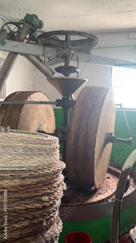 Traditional Oil Pressing in an Old Mill photo