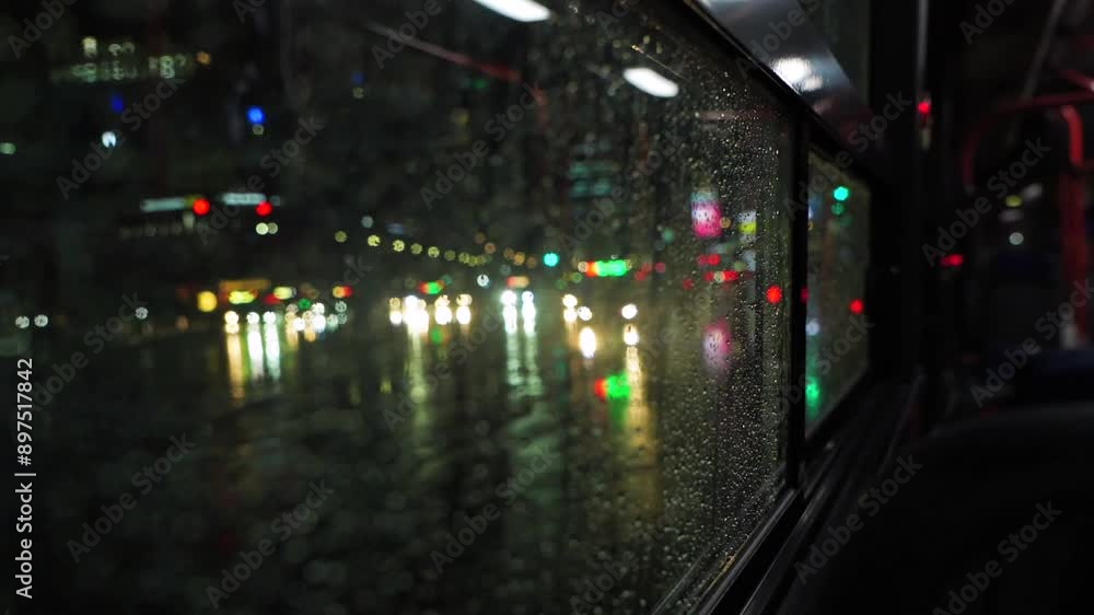 a bus running at night on a rainy day a bus running at night on a rainy day