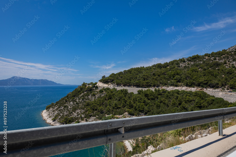 Obraz premium Croatia road. Croatia - Adriatic Highway (Jadranska Magistrala) road along the coast. Croatia. Beautiful nature and landscape. Coastal Road and Sea in Summer