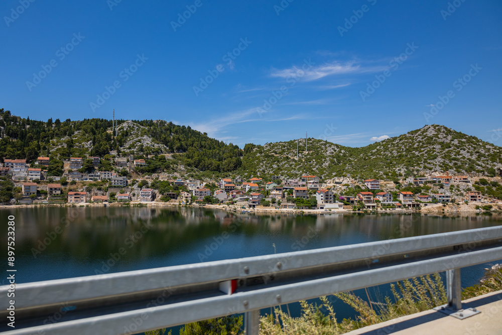 Fototapeta premium Croatia road. Croatia - Adriatic Highway (Jadranska Magistrala) road along the coast. Croatia. Beautiful nature and landscape. Coastal Road and Sea in Summer