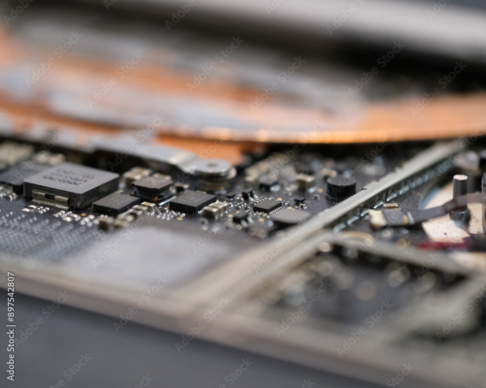 The inside of a laptop laid out on a surface still attached to computer shell The inside of a laptop laid out on a surface still attached to computer shell