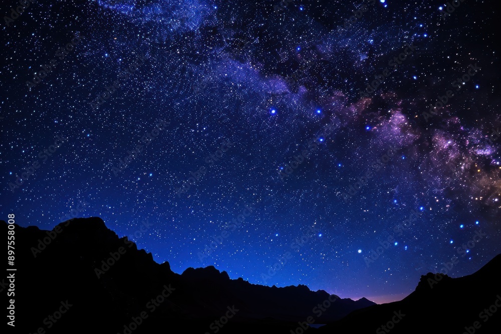 Starry sky, Milky Way, night view of the desert with distant mountains in silhouette Starry sky, Milky Way, night view of the desert with distant mountains in silhouette