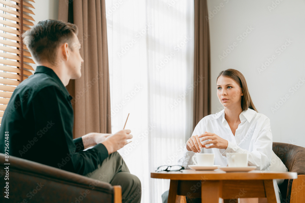 Psychological consultation gaining improvement on mental problem, happy young female patient doing therapy session while psychiatrist making diagnostic on mental illness. Unveiling Psychological consultation gaining improvement on mental problem, happy young female patient doing therapy session while psychiatrist making diagnostic on mental illness. Unveiling