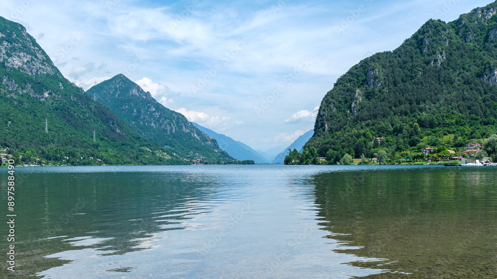 Breathtaking Vista: Lago d'Idro with Majestic Mountains in the Background Breathtaking Vista: Lago d'Idro with Majestic Mountains in the Background