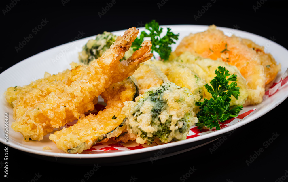 Yam Tempura and Vegetables with a black background Yam Tempura and Vegetables with a black background