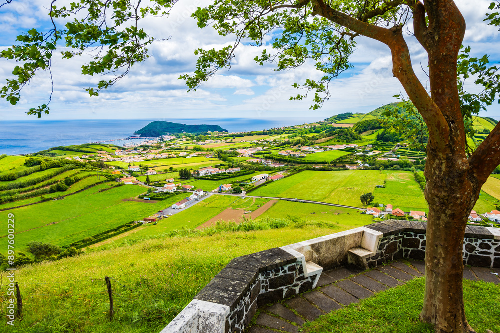 Picnic area and viewpoint over green meadows and hills in rural farming interior, Faial island, Azores, Portugal