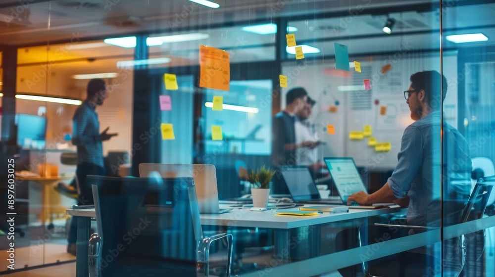 Creative Team of Software Engineers Brainstorming in Modern Glass-Walled Meeting Room Creative Team of Software Engineers Brainstorming in Modern Glass-Walled Meeting Room