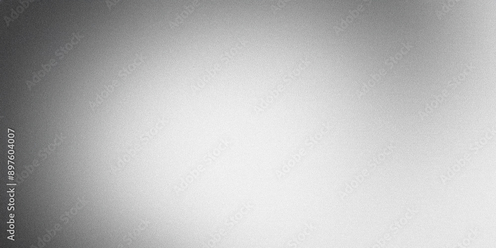 Grainy textured surface with a black to white gradient forming an abstract background Grainy textured surface with a black to white gradient forming an abstract background