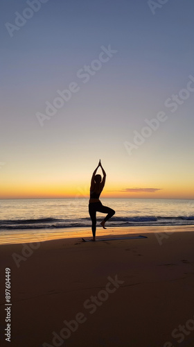 Sunrise Yoga Bliss: A Fit Young Woman Practicing Yoga on a Serene Beach. Copyspace