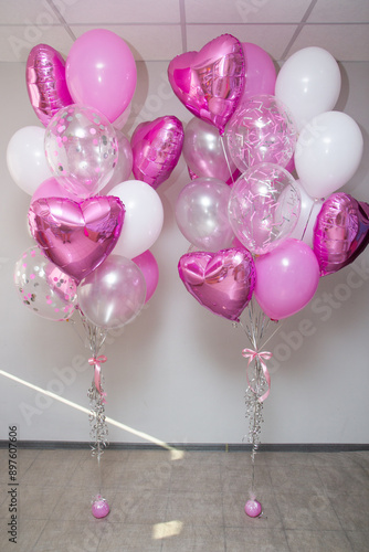 set of pink and white balloons on white background