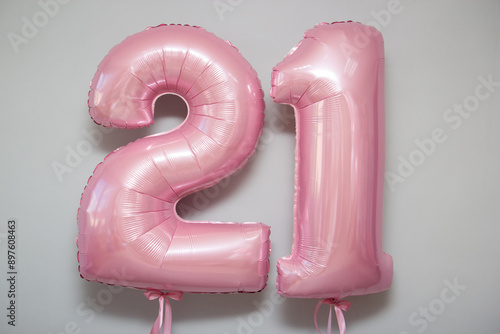 pink balloons numbers 21 on white background