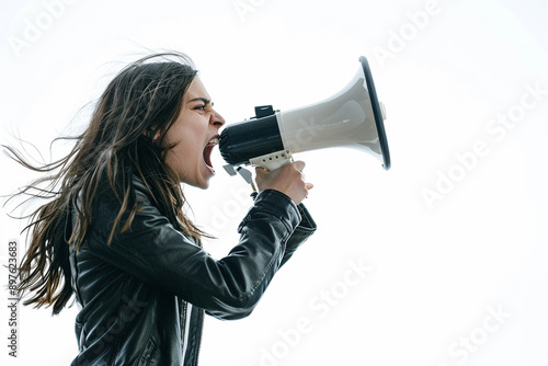 Young woman in a leather jacket shouting through a megaphone against a white background, symbolizing protest and activism with space for copy.