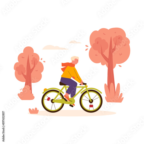autumn people park. A guy rides a bicycle in an autumn park