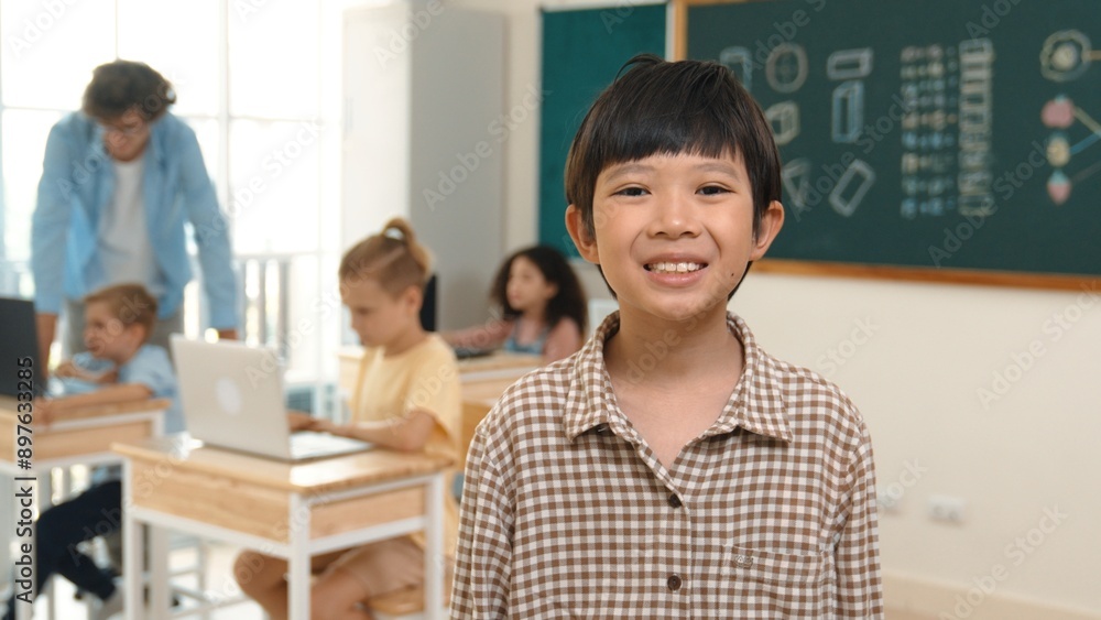 Fototapeta premium Skilled asian boy looking and waving hands while friend studying about writing engineering code or coding prompt. Professional teacher checking prompt while teaching about AI generated. Pedagogy.