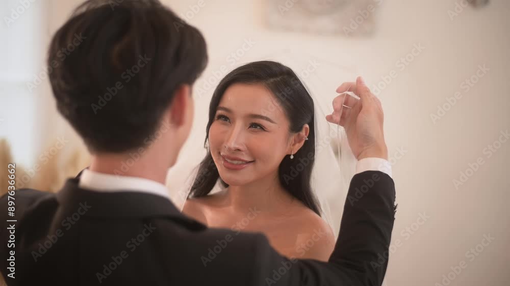 Groom taking off veil from bride in Wedding Celebration, Love and marriage concept Groom taking off veil from bride in Wedding Celebration, Love and marriage concept