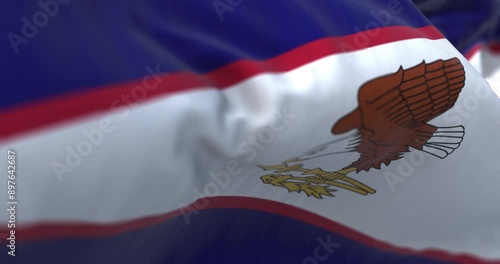 The American Samoa flag in the wind on a clear day photo