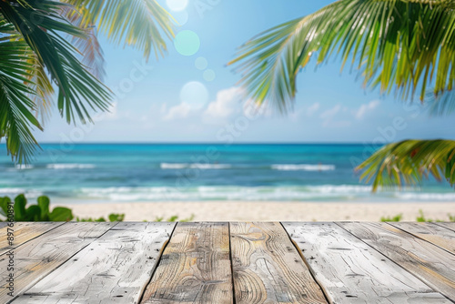 Top of wood table with seascape and palm leaves  blur bokeh light of calm sea and sky at tropical beach background. Empty ready for your product display montage. summer vacation background concept.