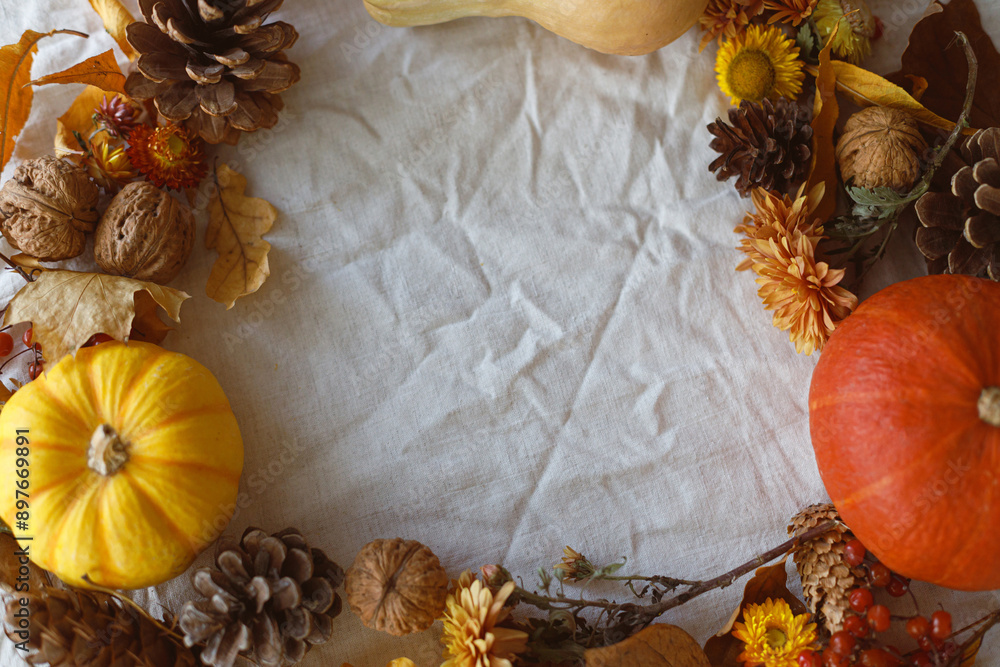 Thanksgiving background. Pumpkins, fall leaves and flowers, berries and pine cones in frame on linen cloth, space for text. Autumn harvest still life. Happy Thanksgiving. Fall banner Thanksgiving background. Pumpkins, fall leaves and flowers, berries and pine cones in frame on linen cloth, space for text. Autumn harvest still life. Happy Thanksgiving. Fall banner