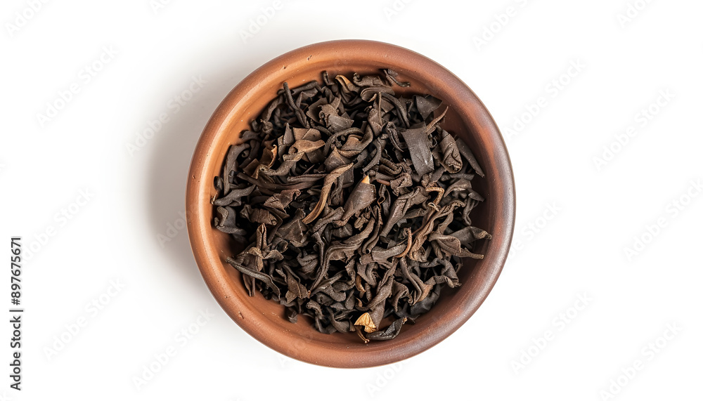 Bowl of traditional Chinese pu-erh tea leaves isolated on white, top view Bowl of traditional Chinese pu-erh tea leaves isolated on white, top view