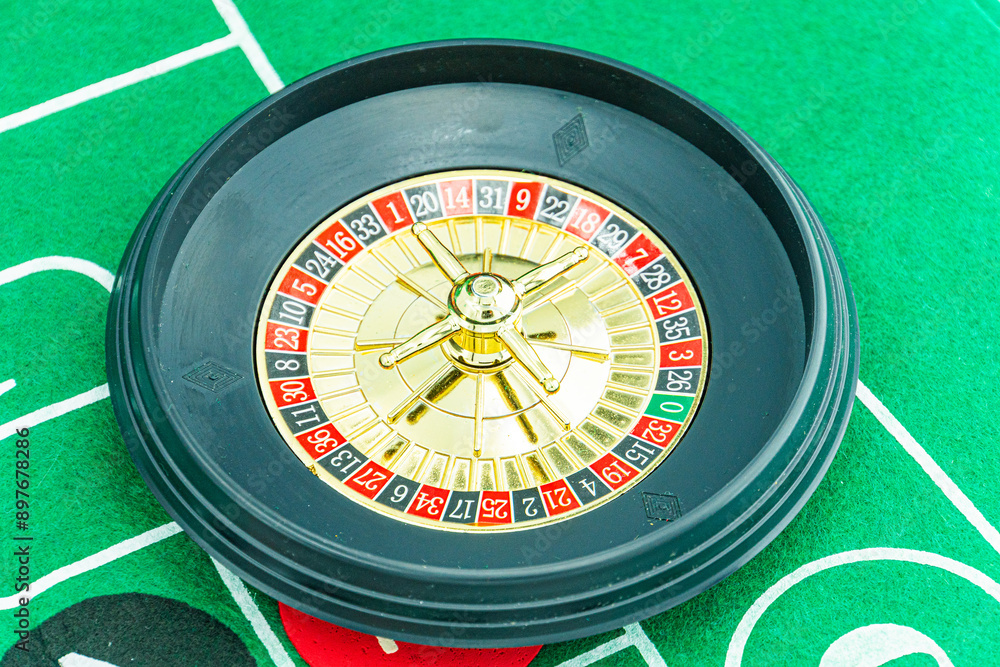Close up shot of a spinning roulette. Presentation of a luxury casino roulette wheel with a yellow spinning fireball. Polished, elegant roulette with golden elements in Las Vegas. Close up shot of a spinning roulette. Presentation of a luxury casino roulette wheel with a yellow spinning fireball. Polished, elegant roulette with golden elements in Las Vegas.