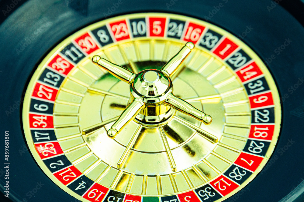 Close up shot of a spinning roulette. Presentation of a luxury casino roulette wheel with a yellow spinning fireball. Polished, elegant roulette with golden elements in Las Vegas. Close up shot of a spinning roulette. Presentation of a luxury casino roulette wheel with a yellow spinning fireball. Polished, elegant roulette with golden elements in Las Vegas.