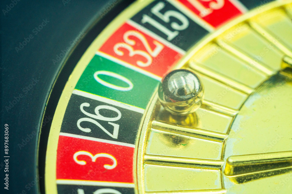 Close up shot of a spinning roulette. Presentation of a luxury casino roulette wheel with a yellow spinning fireball. Polished, elegant roulette with golden elements in Las Vegas.