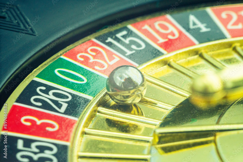 Close up shot of a spinning roulette. Presentation of a luxury casino roulette wheel with a yellow spinning fireball. Polished, elegant roulette with golden elements in Las Vegas. Close up shot of a spinning roulette. Presentation of a luxury casino roulette wheel with a yellow spinning fireball. Polished, elegant roulette with golden elements in Las Vegas.