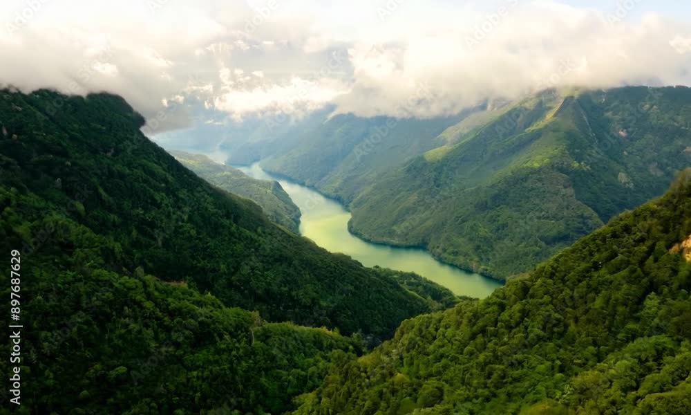 Aerial view of a scenic mountain landscape with lush green valleys. 4K Alpha Video Aerial view of a scenic mountain landscape with lush green valleys. 4K Alpha Video