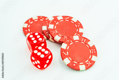 Gambling chips over white Poker chips and dice on white background