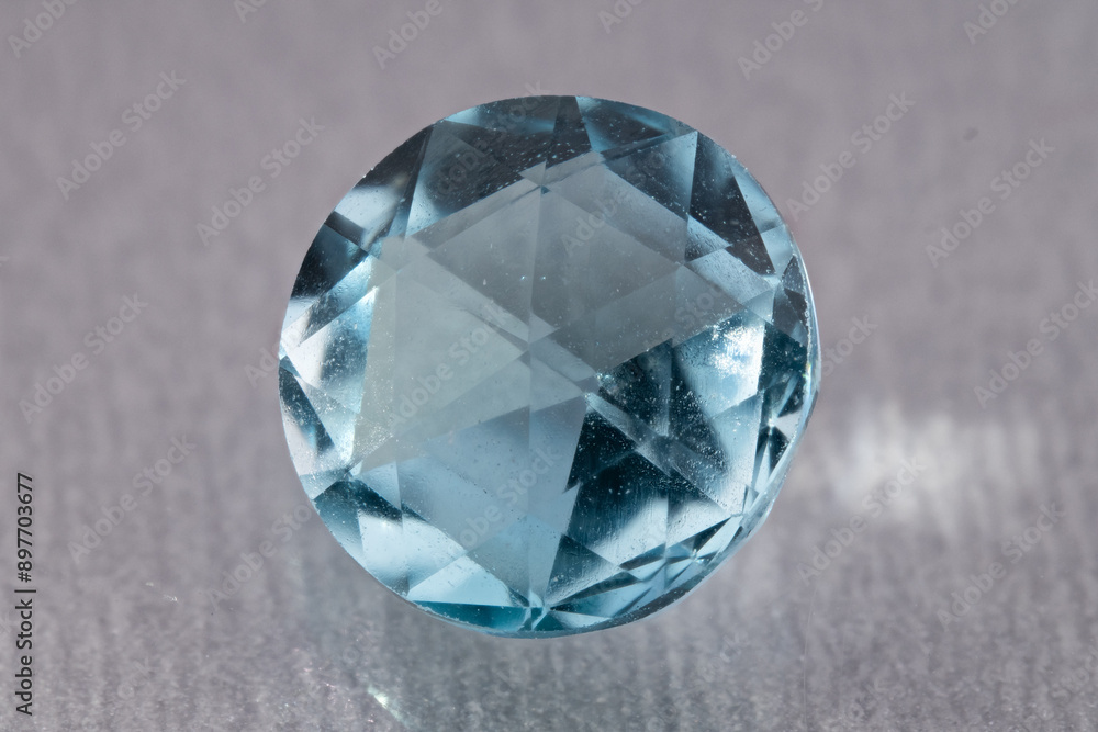 natural blue topaz gem on the isolated white background