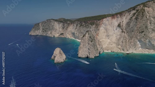 The drone aerial footage of Mizithres beach, Zakynthos Island, Greece. The two conical huge rocks, that bounce from the crystal blue waters in Keri, are called the Small and Big Mitzithra. photo