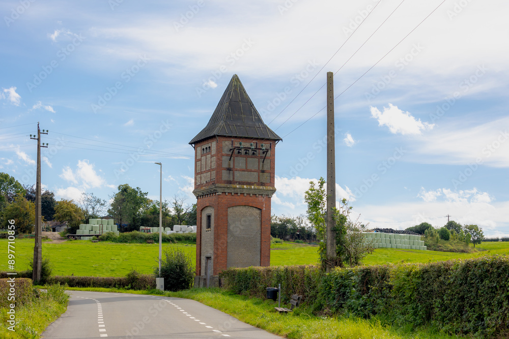 Φωτογραφία Old classic style electric pole with blue sky as background, Transmission tower with cables lines in a small town countryside of Limburg, Municipality in Belgium, Border between Netherlands