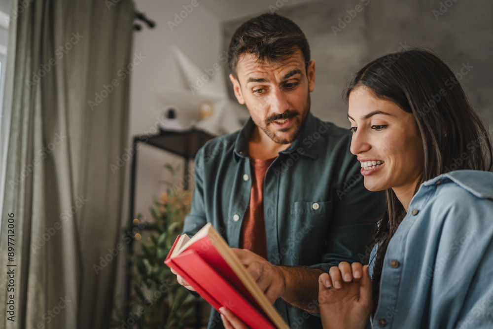 Boyfriend show and explain interesting part of book to his girlfriend Boyfriend show and explain interesting part of book to his girlfriend
