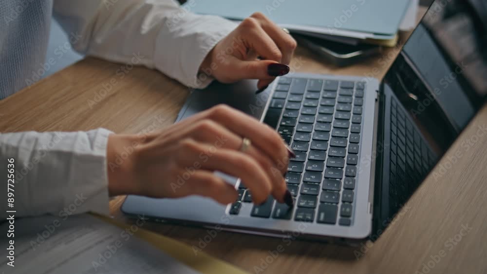 Office worker hands typing laptop at cabinet closeup. Anonymous woman working Office worker hands typing laptop at cabinet closeup. Anonymous woman working