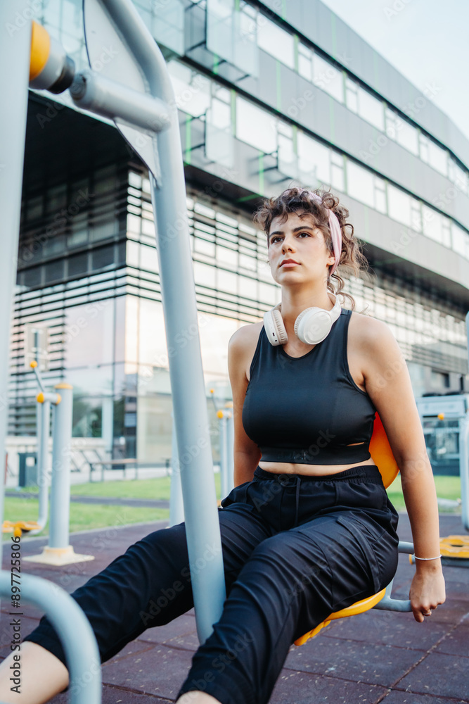Young caucasian woman is training in training park outdoors Young caucasian woman is training in training park outdoors