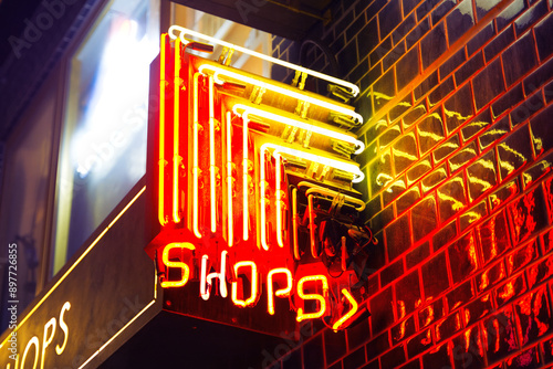 Red and yellow neon shops sign in Hong Kong at night