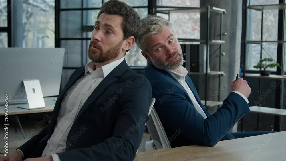 Two upset disappointed stressed worried caucasian men businessmen employees colleagues business partners receive bad news in office failed deal failure unsuccessful group project crisis bankruptcy Two upset disappointed stressed worried caucasian men businessmen employees colleagues business partners receive bad news in office failed deal failure unsuccessful group project crisis bankruptcy
