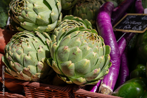 Fresh ripe green organic artichokes heads on local farmers market in Dordogne, France photo