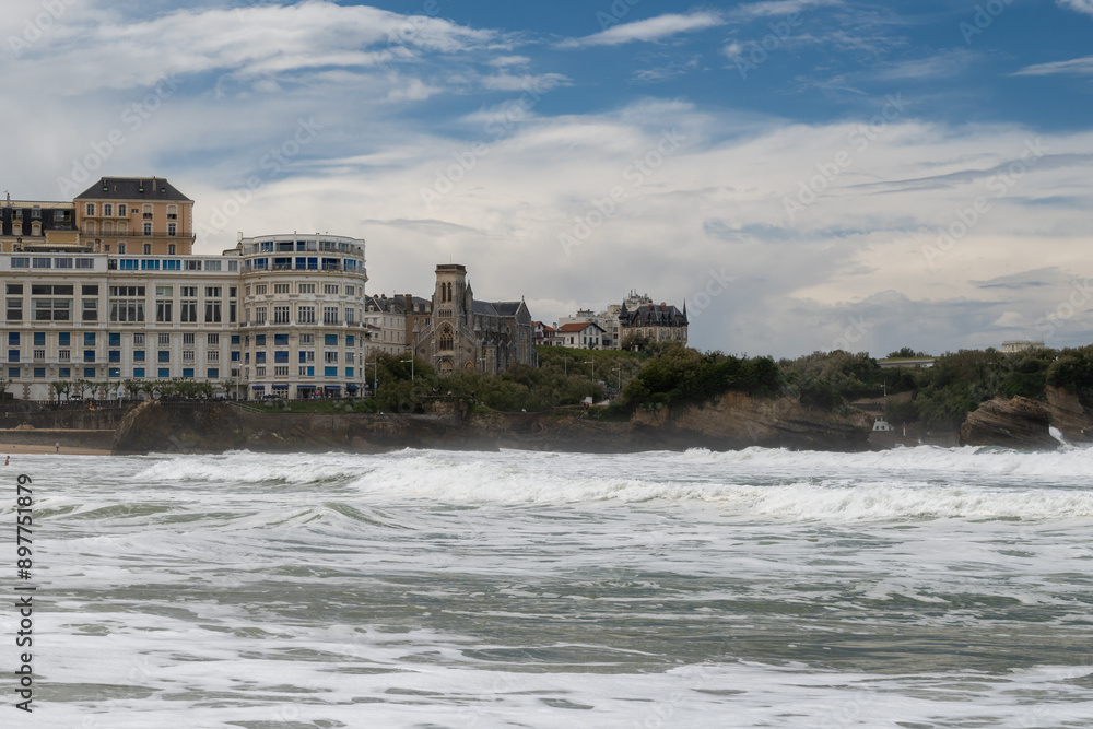 Fototapeta premium Panoramic view from Grand Plage on cliffs, lhouses, sandy beaches of touristic Biarritz city, Basque Country, Bay of Biscay of Atlantic ocean, France