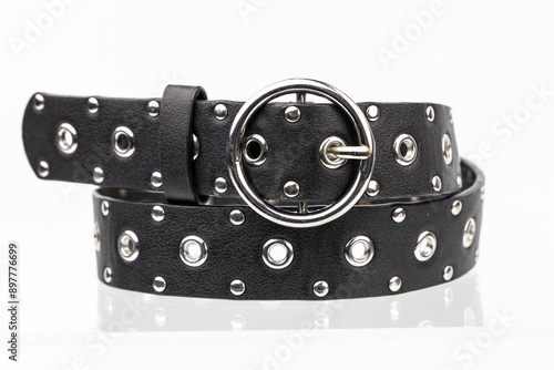 Black Emo Punk Metal leather belt on a white background. Retro Vintage cow hide belt.