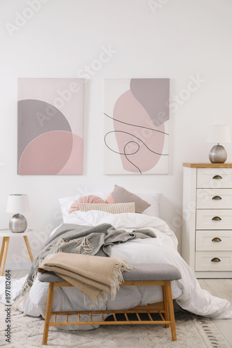 Teen's room interior with modern furniture and beautiful pictures on wall photo