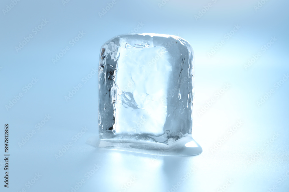 Cube of clear ice on light blue background Cube of clear ice on light blue background