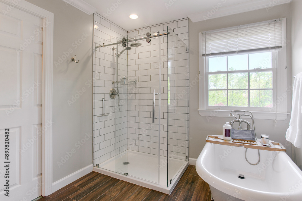 Modern Bathroom With Glass Shower And Freestanding Tub In Bright Setting