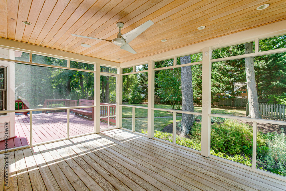 Cozy Screened-In Porch With Ceiling Fan And Deck Overlooking Green Backyard