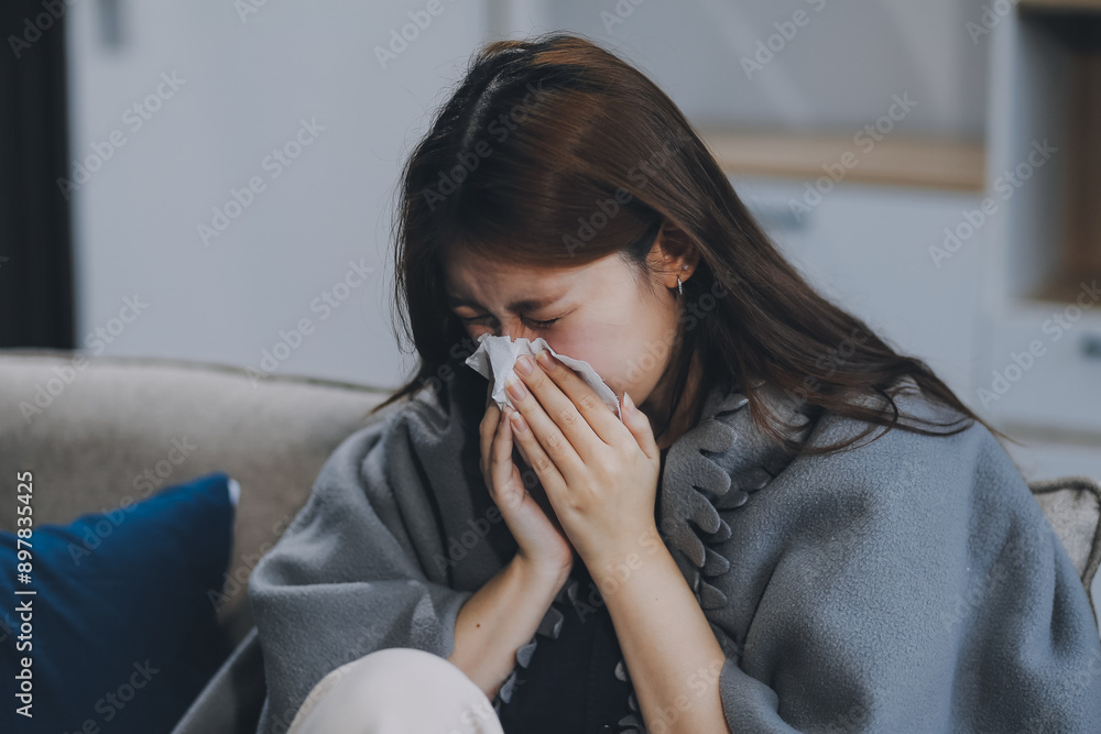 A woman with a cold with pills is treated at home chooses which drugs to take and self-medicates, checks the expiration date while sitting on the couch at home A woman with a cold with pills is treated at home chooses which drugs to take and self-medicates, checks the expiration date while sitting on the couch at home