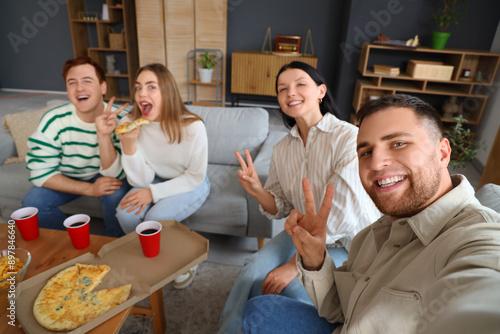 Group of young friends taki...